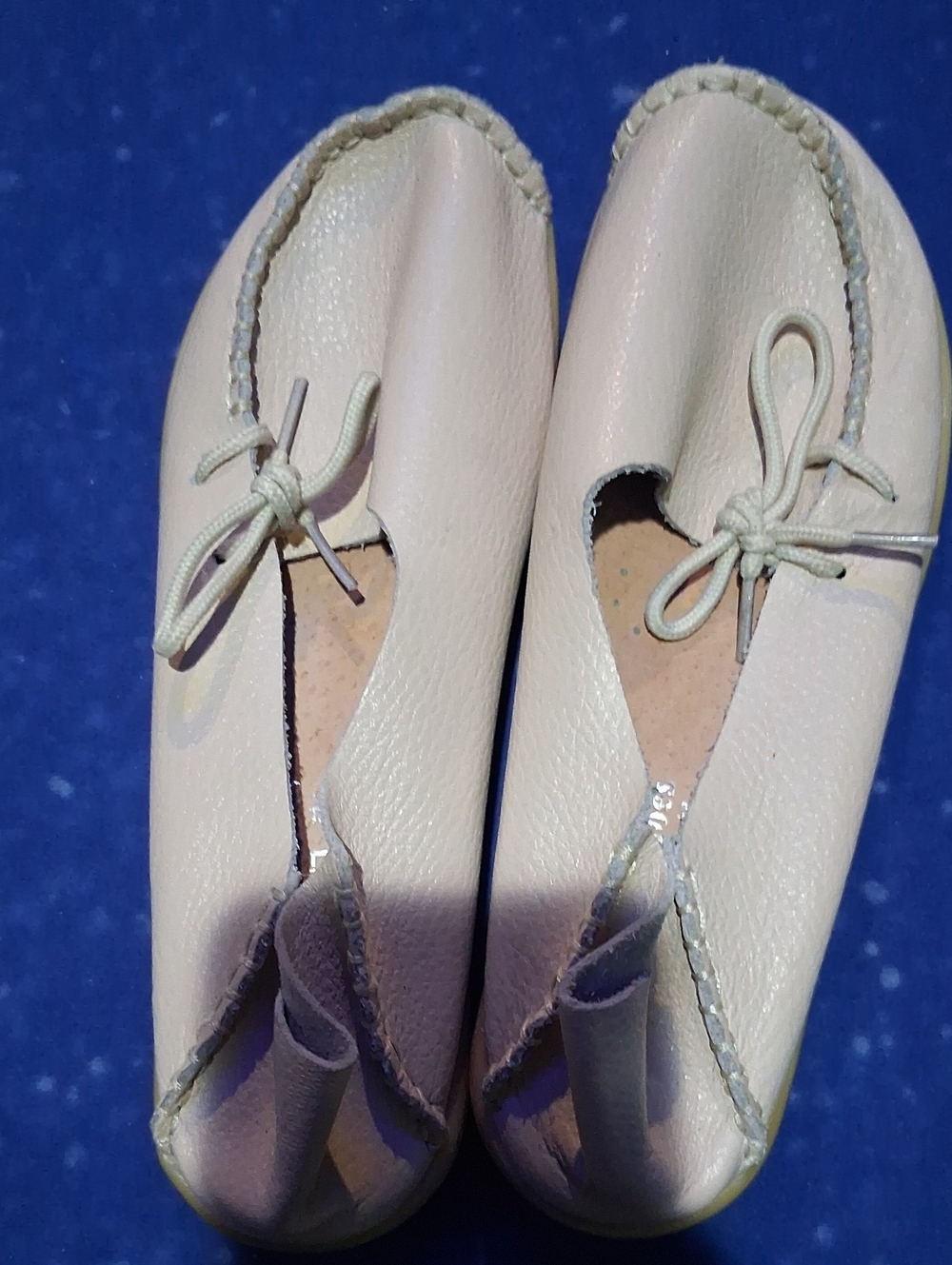 Women's Cream Moccasin Flats with Bow Tie Accent